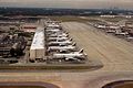 Several planes parked at the airport.