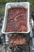 St. Louis-style barbecue – pork steaks cooking