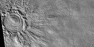 Close view of layered feature in crater, as seen by HiRISE under HiWish program. Feature seems to be higher than parts of the crater rim.