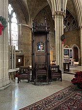 Cathedra displaying the arms of Earl K. Fernandes