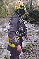 Side view of caving head light and small one-piece lights attached to caving helmet for shallow cave dives.