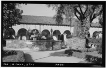 A photo of one of the fountains in Brand Park as well as the statue of Junípero Serra taken by Henry F. Withey in March 1936.