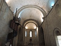 Barrel-vaulted nave and fine ashlar masonry; the spiral staircase leads to the secret room
