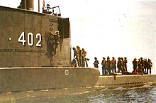 Nanggala in training in East Kalimantan, with Indonesian soldiers on her deck.