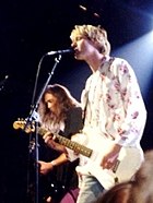Kurt Cobain playing guitar live with Nirvana.