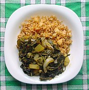 Rice and Chenopodium album leaf curry with onions and potatoes; a vegetarian curry