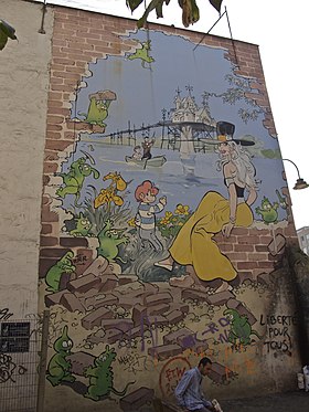 Peinture d'Isabelle (à gauche) et de Calendula (à droite) sur une façade à Bruxelles.