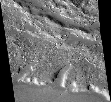 Channels just to south of Sinton Crater, as seen by CTX camera (on Mars Reconnaissance Orbiter). These were created when the impact occurred in ice-rich ground. Note: this is an enlargement of the previous image of west side of Sinton.