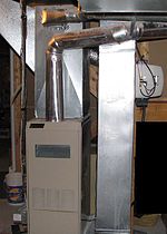 A photo of a forced-air gas furnace, circa 1991.