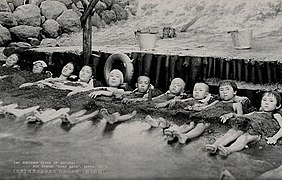 Women and children take a sand bath at a hot spring, Japan Wellcome V0049853