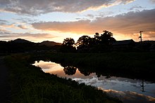 夏の夕、蒲生川に架かる河崎橋より、佐弥乃兵主神社（岩美町）方面を望む。