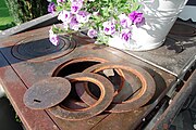 A stovetop with iron fitting rings