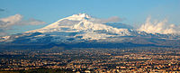 Mount Etna rising over suburbs of Catania