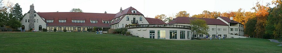 Historic structure to the left, pool additions with 20th-century addition to the right.