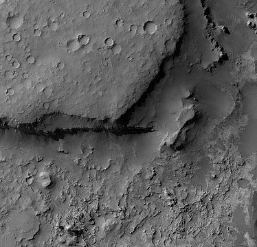 Wislicenus Crater Floor, as seen by HiRISE. Erosion on floor has made layers visible.