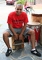 Afro-Argentine man playing a quisanche for candombe