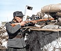 Finnish Corporal Onni Ryyppö of the 44th Border Jäger Company, use a captured Mosin-Nagant sniper rifle with PEM scope in the frontlines at Valkeasaari (Beloostrov), Karelian isthmus, 15 April 1942