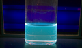 Perylene dissolved in dichloromethane exposed to Short Wave UV radiation