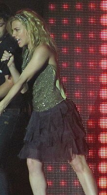 Singer Kimberly Perry, singing into a microphone.