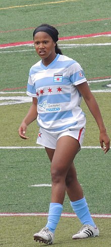 Zakiya Bywaters wearing a blue and white Chicago Red Stars jersey.