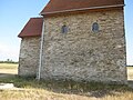 N side showing original arched windows with keystone.