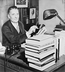 Photographic of Maxwell Perkins sitting at a desk