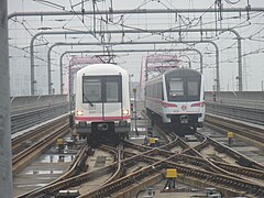 06C01 train on the left and 06C02 train on the right