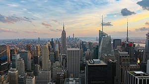 New York, described as the cultural,[১][২][৩][৪] financial,[৫][৬][৭] diplomatic, and media capital[৮][৯] of the world.[১০][১১] Manhattan (above), functions as the financial and cultural core of the entire New York metropolitan area.