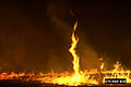 12. An image of a fire tornado, which only occurs under extreme conditions in large wildfires.