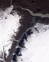 Small glaciers spilling into a mostly dry valley in western Greenland