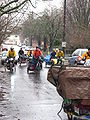 Bicyclists in Portland brave the rain to help each other move by bike