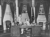 Franklin D. Roosevelt working at his desk in the Oval Office