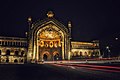 A long exposure photograph of the gate at night