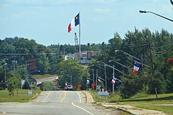 A huge Acadian flag dominates St-Louis' skyline