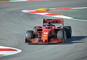 Charles Leclerc driving a scarlet red Ferrari Formula One car at a test session in Spain in early 2020