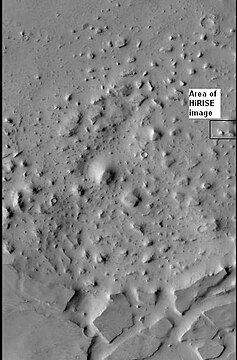 Box outlines area in next image from HiRISE. Knobs and mesas were probably formed from the erosion of deposits in an old crater.