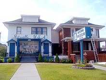 Two two-storey houses with signs marking one as Hitsville U.S.A.