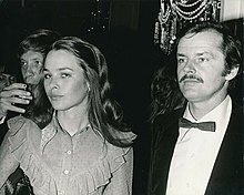 Nicholson standing next to a woman