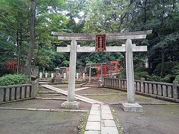 a stone myōjin torii