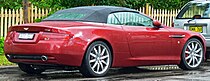 Rear three-quarters view of a red DB9 Volante convertible