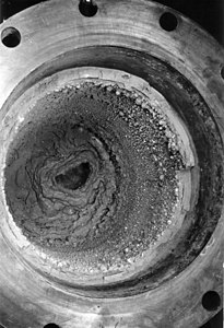Remnant slag coating the interior of a bomb at Ames process, author unknown