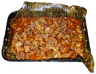 Cochinita pibil is a traditional Mexican slow-roasted pork dish from the Yucatán Península of Mayan origin that involves marinating the meat in acidic citrus juice.