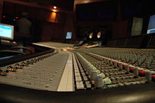 A recording console inside a studio.