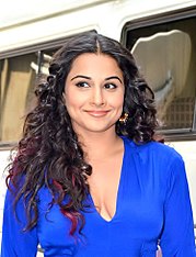 Vidya Balan is smiling away from the camera