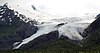 A large glacier sloping down a mountain