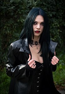 A young goth woman wearing a leather jacket
