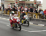 Giacomo Agostini (9) MV Agusta 500c John McGuinness 500cc Honda - Classic TT Parliament Square, Ramsey 24 August 2013