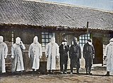 Plague workers wearing personal protective equipment