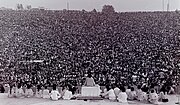 Opening ceremony at Woodstock. Swami Satchidananda giving the opening speech.