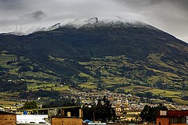 Galeras Volcano shrouded in cloud and rare snow, overlooking the city of Pasto